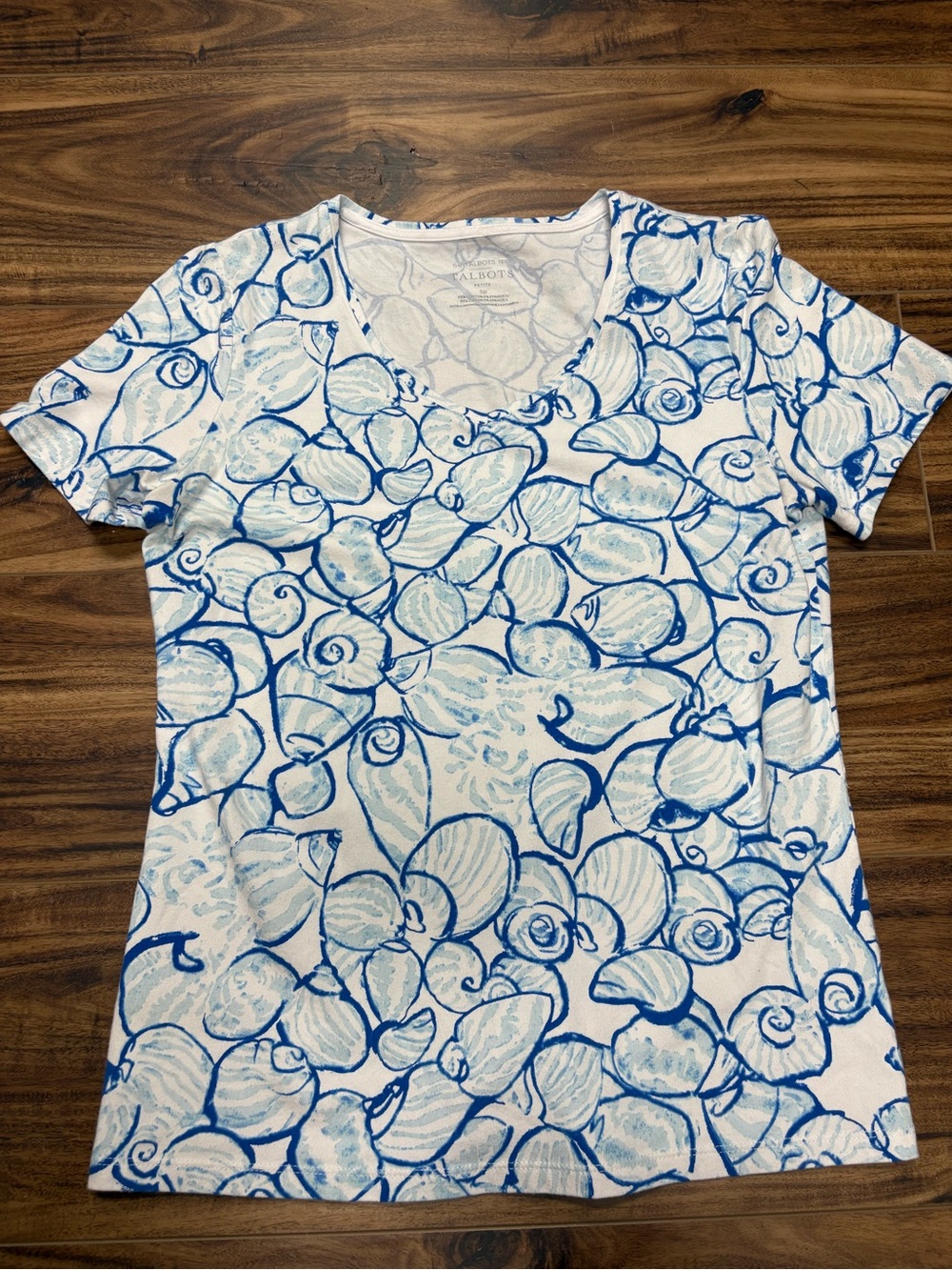 Talbots v-neck t-shirt features a blue shell print on a white background